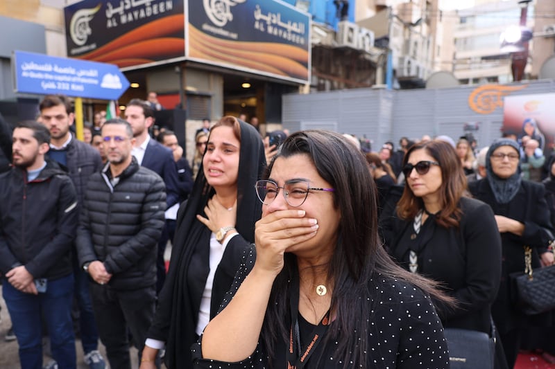 Mourners at the funeral of the two journalists outside Al Mayadeen TV's building in Beirut. AFP