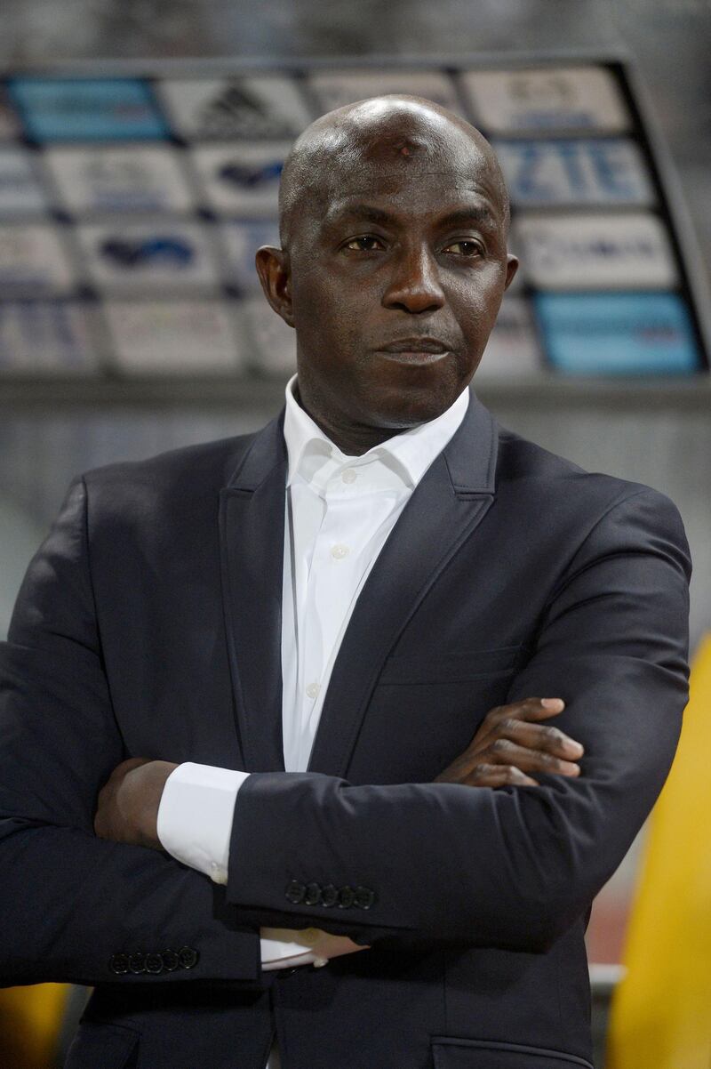 (FILES) In this file photo taken on March 29, 2016 Nigeria's head coach Samson Siasia looks on during their African Cup of Nations group G qualification football match between Egypt and Nigeria at the Borg el-Arab Stadium in Alexandria. FIFA on August 16, 2019 banned former Nigeria Football Federation official Samson Siasia for life after the body's ethics panel found him guilty of taking bribes in connection with match fixing.  / AFP / KHALED DESOUKI
