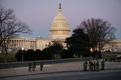 Members of the New York Army National Guard outside the U.S. Capitol building in Washington, D.C., U.S., on Thursday, Jan. 7, 2021. Joe Biden was formally recognized by Congress as the next U.S. president early Thursday, ending two months of failed challenges by his predecessor, Donald Trump, that exploded into violence at the U.S. Capitol as lawmakers met to ratify the election result. Photographer: Graeme Sloan/Bloomberg