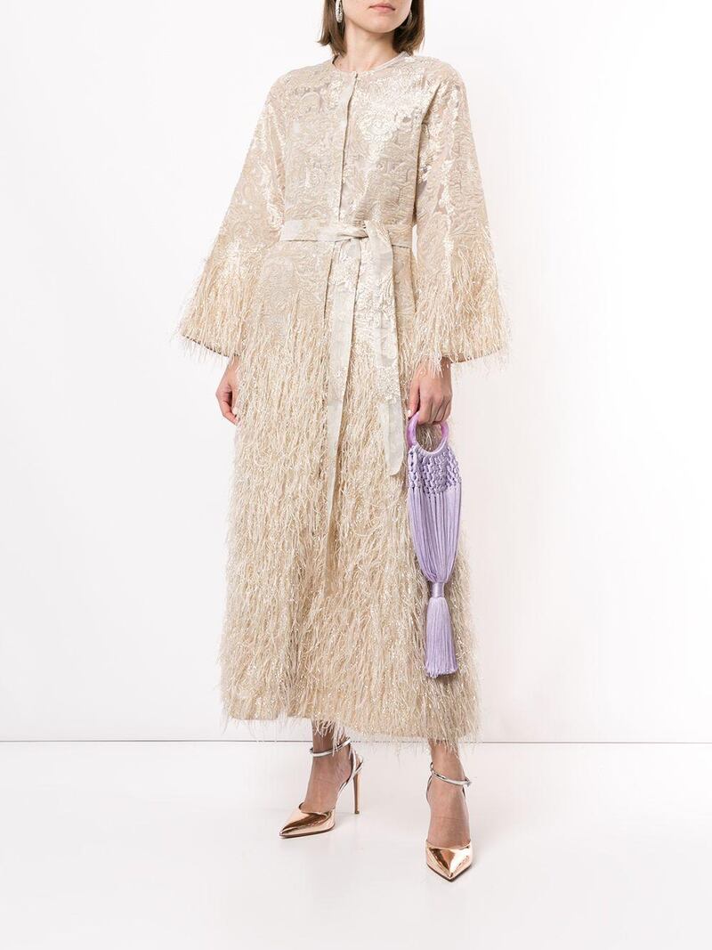 Feather trimmed kaftan, Dh2,535, Bambah, Farfetch. Courtesy Farfetch