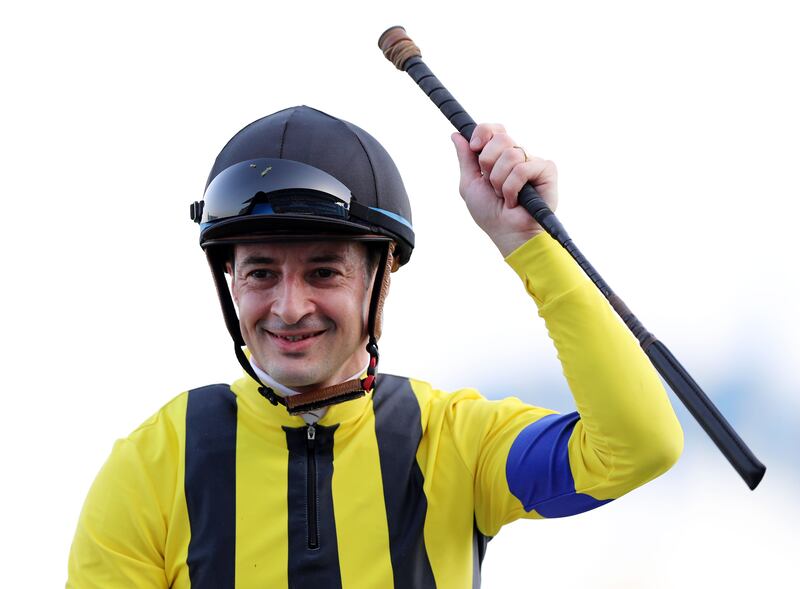 Christophe Lemaire celebrates after guiding Stay Foolish to victory in the Dubai Gold Cup. Chris Whiteoak / The National