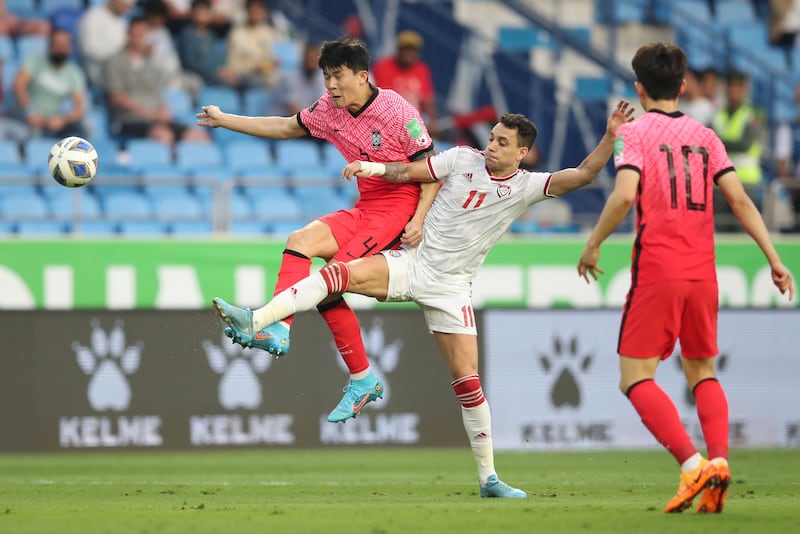Kim Min-jae of South Korea and UAE's Caio Canedo battle for the ball. EPA