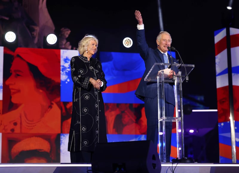 King Charles and the queen consort, wearing a wool and cashmere blend robe by Saudi designer Yahya Al Bishri, on stage during the platinum jubilee concert on June 4, 2022. AP 