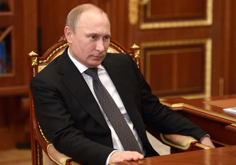 Russian president Vladimir Putin listens during a meeting in Moscow's Kremlin on Tuesday, December 16. A surprise central bank decision to raise interest rates to 17 per cent from 10.5 per cent came in the early hours of Tuesday. Alexei Nikolsky, Presidential Press Service/AP Photo/RIA Novosti