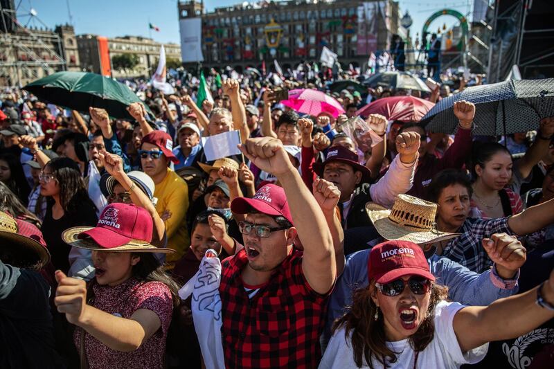 Supporters celebrate during the presidential inauguration event. Bloomberg