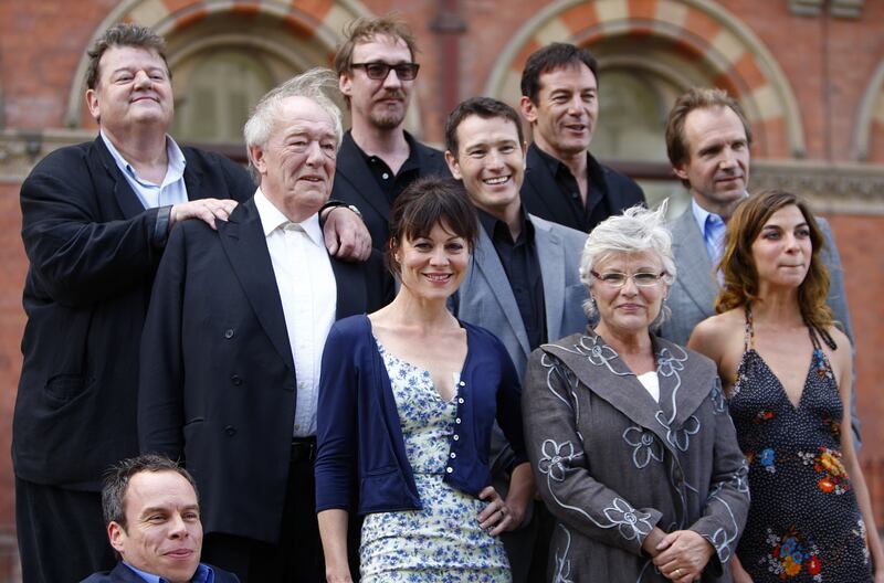 From left to right: Robie Coltrane, Warwick Davis, Michael Gambon, David Thewlis, Helen McCrory, Nick Moran, Jason Isaacs, Julie Walters, Ralph Fiennes and Natalia Tena during a photocall with the cast of Harry Potter And The Deathly Hallows, Part 2 in London in 2011. PA Images