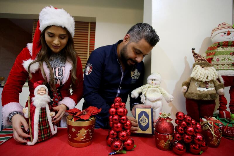 Ziad, a Muslim man, and his wife Lamees Homidan, a Lebanese Christian, make Christmas decorations at their home, in Riyadh, Saudi Arabia. Reuters