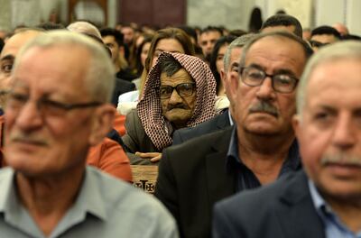 Iraqi Catholics attend Easter Sunday mass at Qaraqosh's Al Tahera Church in the northern Iraqi province of Nineveh. AFP