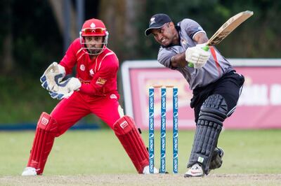 KING CITY, CANADA : August 8, 2013 UAE batsman Arshad Ali (right) hits out as   Canada wicket keeper Ashish Bagai looks on during the one day international  at the Maple Leaf Cricket club in King City, Ontario, Canada ( Chris Young for The National). For Sports *** Local Caption ***  chy117.jpg
