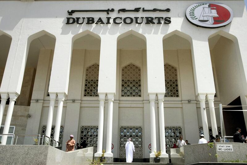 A closeup shot shows the facade of the Dubai Courts building during a hearing on April 04, 2010 in the case of a British couple sentenced to a month in jail after being convicted of kissing in public in a restaurant in the Muslim Gulf emirate. The couple's lawyer said the appeals court upheld the one-month prison sentence against the two, named by the British press as Ayman Najafi, 24, a British expat, and tourist Charlotte Lewis, 25. The couple were arrested in November 2009, after they were accused of consuming alcohol and kissing in a restaurant in the trendy Jumeirah Beach Residence neighbourhood.     AFP PHOTO/STR / AFP PHOTO
