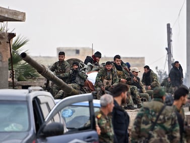 Syrian army soldiers advance in Tall Touqan village, in Syria's northwestern Idlib province, about 45 kilometres southwest of Aleppo, on February 5, 2020. Syrian regime forces pressed on with their offensive in the northwest that has displaced half a million people, despite heightened tensions with Turkey. (Photo by AFP)
