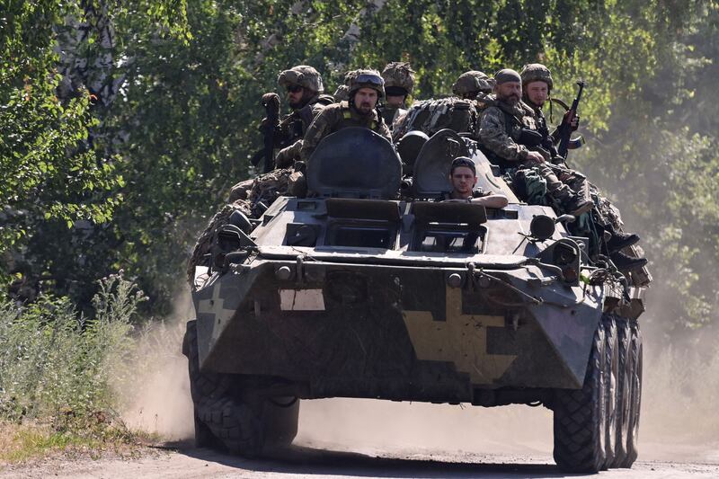 Ukrainian soldiers in an armoured fighting vehicle in Siversk, on which Russian forces are expected to converge. AFP