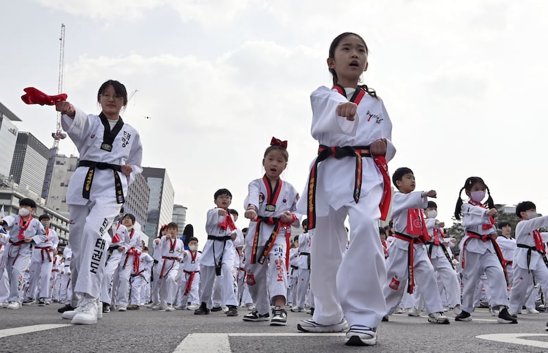 Children participate in a taekwondo demonstration at Gwanghwamun Square in Seoul. AFP