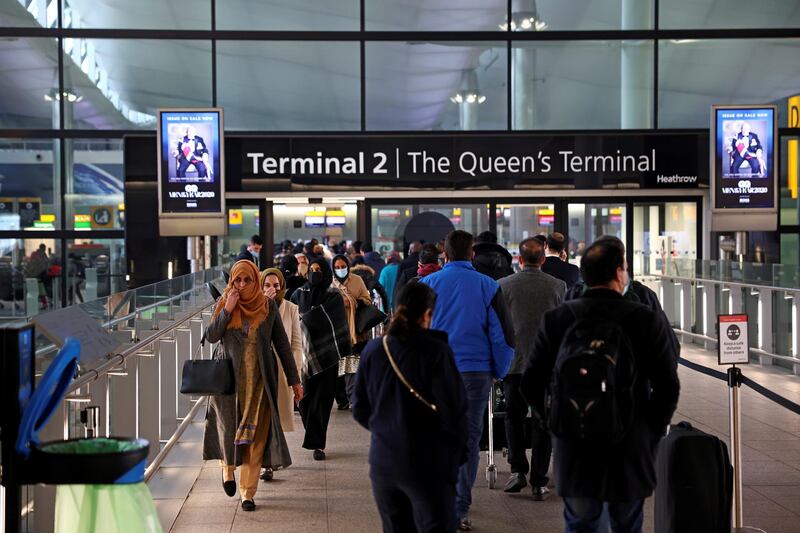 FILE PHOTO: People queue to enter terminal 2, as tighter rules for international travellers start, at Heathrow Airport, amid the spread of the coronavirus disease (COVID-19) pandemic, London, Britain, January 18, 2021. REUTERS/Henry Nicholls/File Photo