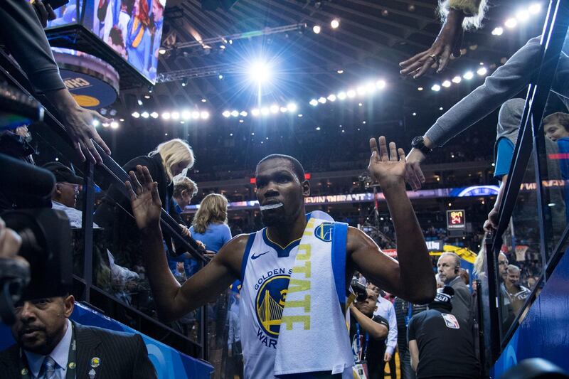 Golden State Warriors forward Kevin Durant 'high-fives' fans after scoring his 20,000th career point during the game against the LA Clippers. Kyle Terada-USA TODAY Sports