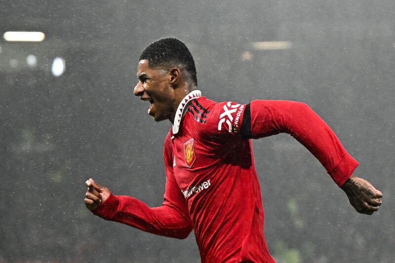 Manchester United's English striker Marcus Rashford celebrates after scoring his team first goal during the English Premier League football match between Manchester United and Nottingham Forest at Old Trafford in Manchester, north west England, on December 27, 2022.  (Photo by Oli SCARFF / AFP) / RESTRICTED TO EDITORIAL USE.  No use with unauthorized audio, video, data, fixture lists, club/league logos or 'live' services.  Online in-match use limited to 120 images.  An additional 40 images may be used in extra time.  No video emulation.  Social media in-match use limited to 120 images.  An additional 40 images may be used in extra time.  No use in betting publications, games or single club/league/player publications.   /  