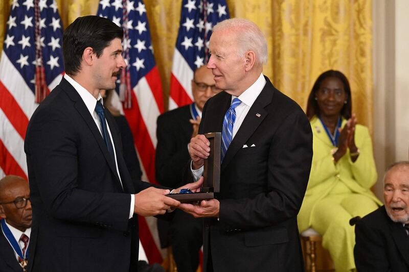 Mr Biden posthumously awards the Presidential Medal of Freedom to workers' rights lawyer Richard Trumka. It was accepted by his son, Richard Trumka Jr. AFP