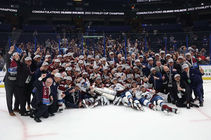 Colorado Avalanche coaches and players pose for a photo. AFP