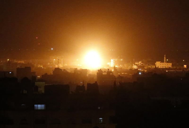 A ball of fire billows above buildings in Rafah in the southern Gaza Strip during Israeli strikes on March 27, 2019. Palestinian militants fired three rockets at Israel overnight prompting retaliatory fire from Israel, with the exchanges threatening a Hamas-declared truce. They came after Prime Minister Benjamin Netanyahu said he was prepared for further military action in Gaza, at a highly sensitive time ahead of Israel's April 9 elections.
 / AFP / SAID KHATIB
