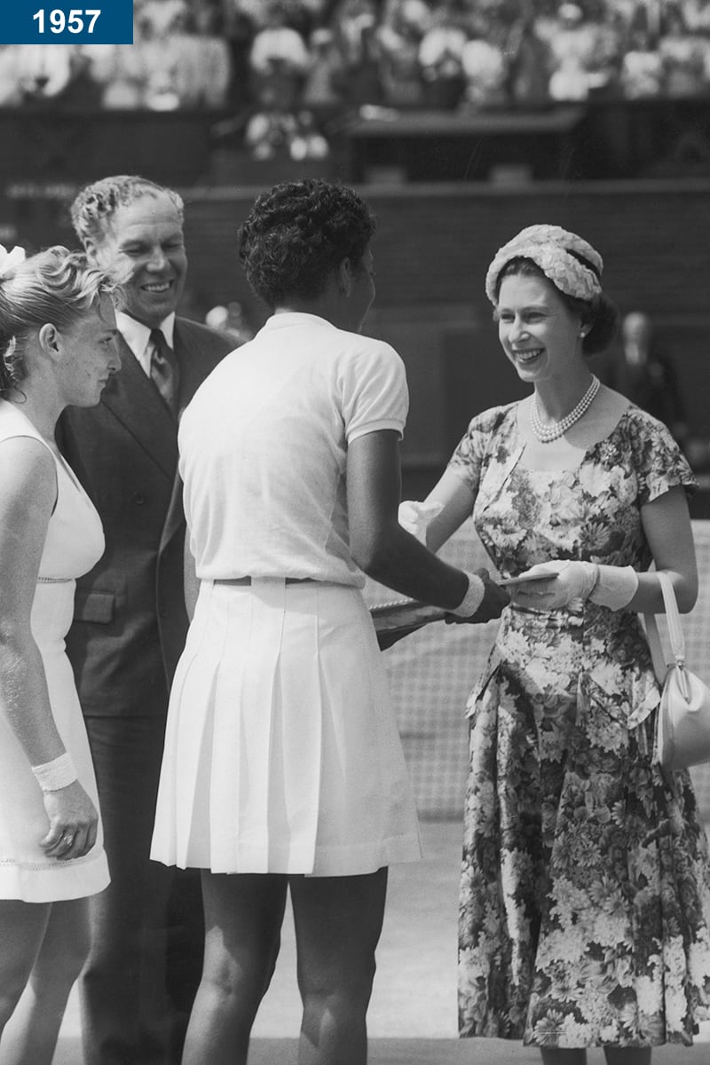 1957: The queen presents the trophy to American tennis player Althea Gibson after she won the women's singles tennis title at Wimbledon.