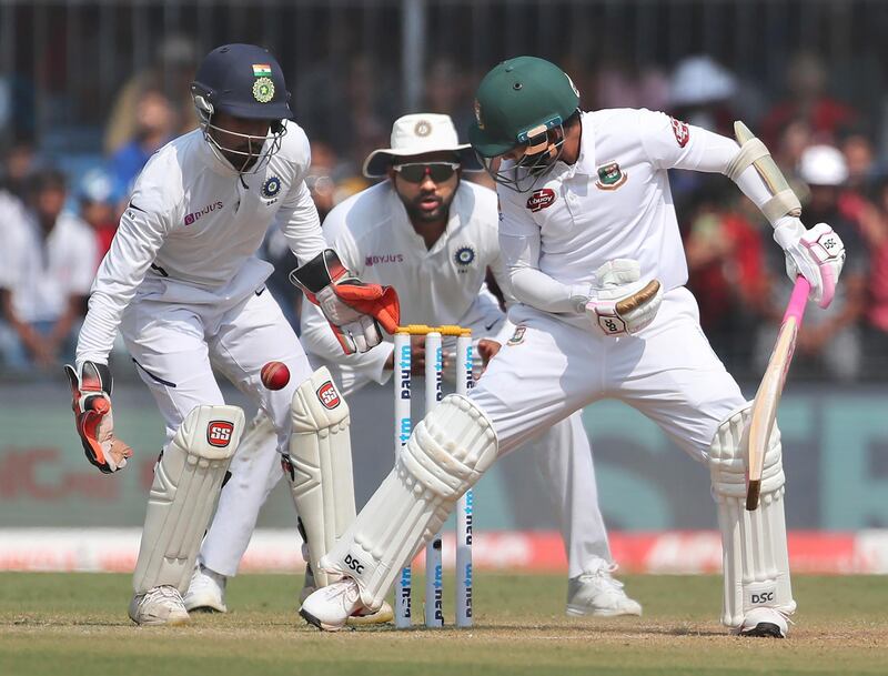 Bangladesh batsman Mushfiqur Rahim, right, watches the ball after missing a shot. AP