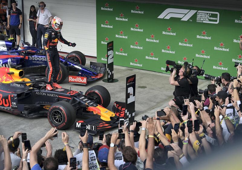 Red Bull's Dutch driver Max Verstappen celebrates after winning the F1 Brazil Grand Prix, at the Interlagos racetrack in Sao Paulo, Brazil on November 17, 2019. (Photo by CARL DE SOUZA / AFP)