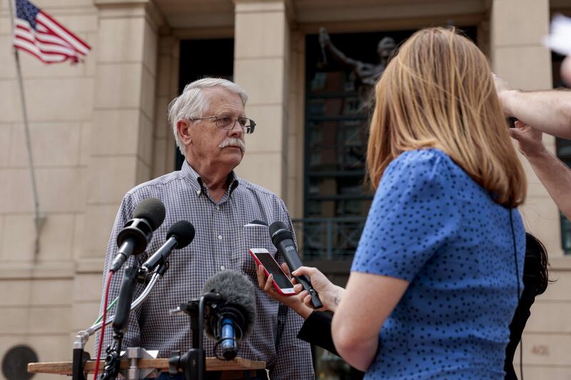 Mr Mueller speaks to reporters outside a courthouse after the announcement of the guilty verdict for Elsheikh. AFP
