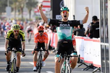 Germany's Pascal Ackermann celebrates winning the opening stage of the UAE Tour in on Sunday. AP