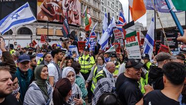 Police come between pro-Israel and pro-Palestinian demonstrators at Picadilly Circus in London. (Photo by Dan Kitwood / Getty Images)