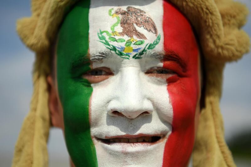 A Mexico fan enjoys the pre-match atmosphere prior to the 2018 FIFA World Cup Russia group F match between Mexico and Sweden at Ekaterinburg Arena on in Yekaterinburg, Russia, on June 27, 2018. Hector Vivas / Getty Images