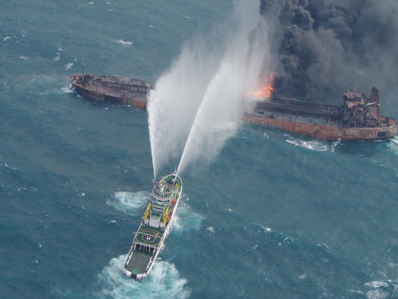 A rescue ship works to extinguish the fire on the stricken Iranian oil tanker Sanchi in the East China Sea, on January 10, 2018 in this photo provided by Japan’s 10th Regional Coast Guard. Picture taken on January 10, 2018.  10th Regional Coast Guard Headquarters/Handout via REUTERS ATTENTION EDITORS - THIS PICTURE WAS PROVIDED BY A THIRD PARTY.     TPX IMAGES OF THE DAY