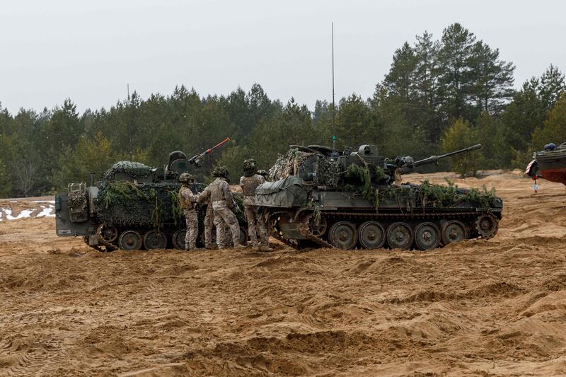 Soldiers take part in a military exercise at the Adazi military base, north east of Riga, Latvia. AFP.