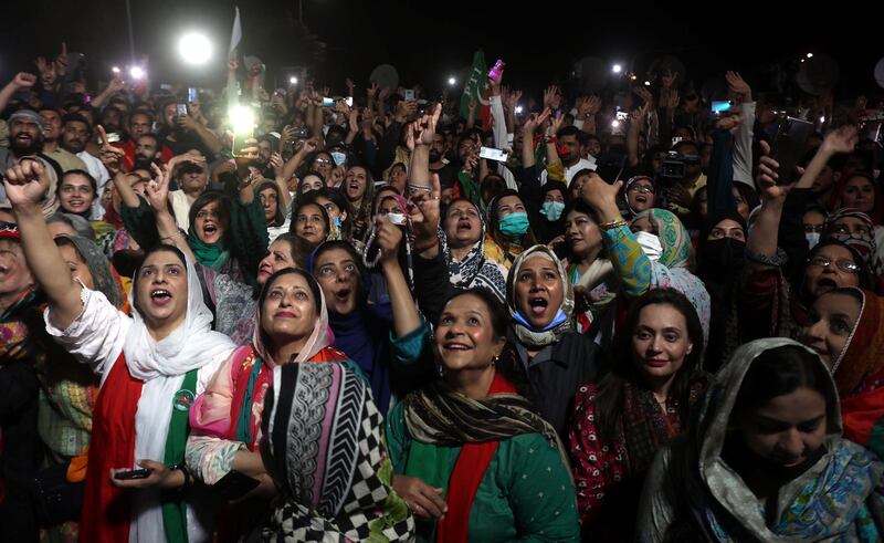 Supporters of Imran Khan listen to his speech during a rally in Islamabad. The incumbent prime minister says there has been unacceptable meddling in Pakistan's democratic institutions and a transitional government should be formed to organise new elections. EPA