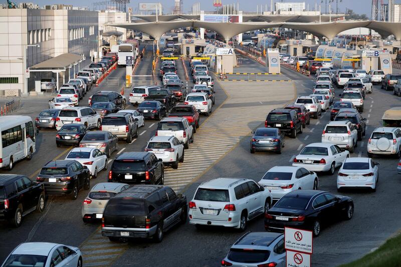 Saudi motorists queue at the Bahrain immigration check point to cross the King Fahd Causeway into Bahrain.  Reuters