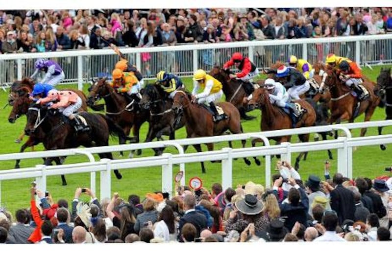 Black Caviar, with Luke Nolen aboard, leads the pack home in the Diamond Jubilee Stakes, the tightest finish of the races held at Royal Ascot in honour of the Queen's 60-year reign.