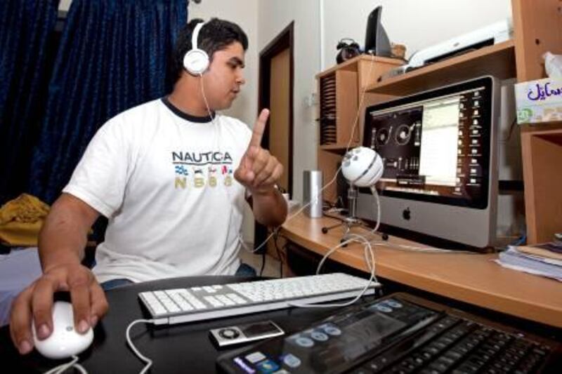 Sharjah - June 20, 2010 - Muhammed Ali Jamadar or Mail as he goes by on air, broadcasts his internet radio show as part of the Campus Radio project from a friend's apartment in Sharjah, June 20, 2010. (Photo by Jeff Topping/The National) 
 