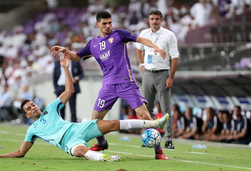 Al Ain, United Arab Emirates - August 21st, 2017: Al Ain's Mohnad Salem and Al Hilal's Carlos Eduardo during the Asian Champions League game between Al Ain v Al Hilal. Monday, August 21st, 2017 at Hazza Bin Zayed Stadium, Al Ain. Chris Whiteoak / The National