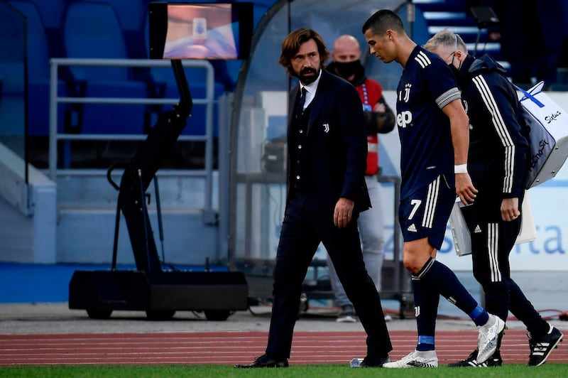 Concerned Juve manager Andrea Pirlo talks to Cristiano Ronaldo after the attacker was forced off through injury. AFP