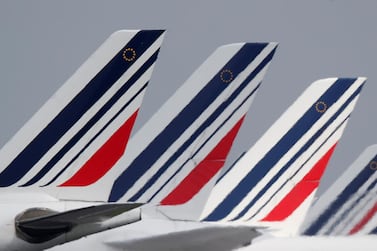 The tails of Air France airplanes parked at the Charles-de-Gaulle airport.  Labour unions have called for a strike from June 23 to 26, reigniting a costly labour conflict at the height of the busy summer travel season. Christian Hartmann / Reuters 