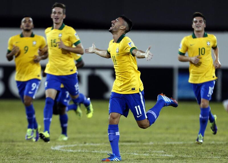 Boschilia, centre, scored twice for Brazil against Honduras on Wednesday night. Karim Sahib / AFP