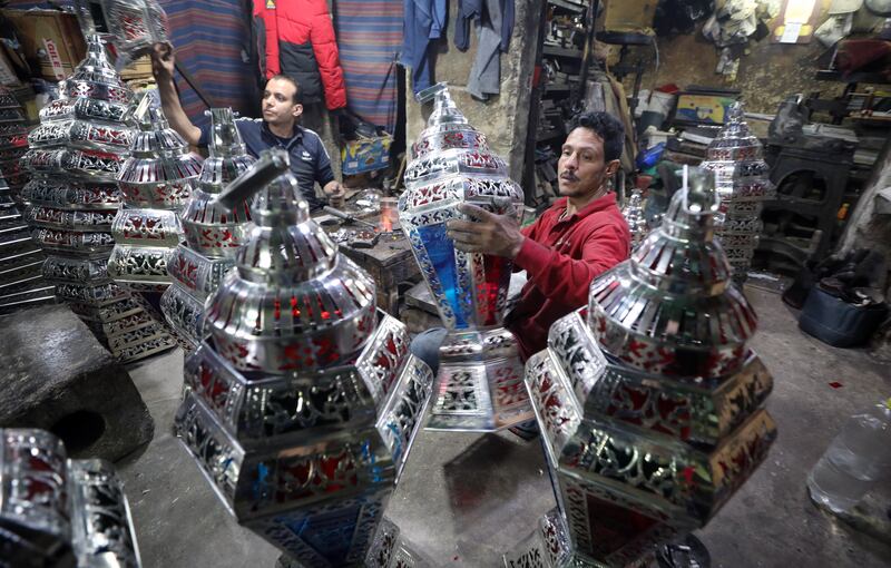 Egyptian craftsmen produce Ramadan lanterns, called Fanous, at a workshop in Cairo.   EPA