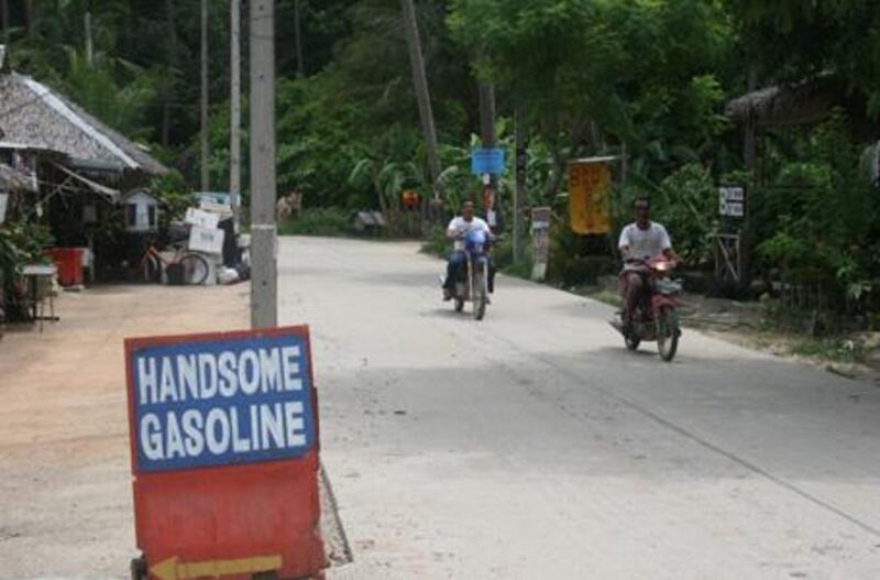 The amusing advertising boards outside petrol stations are a regular site in rural Thailand.