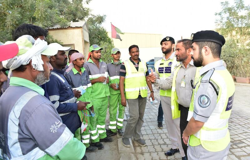 Police officers took to the streets of Sharjah to alert blue collar workers in particular about the scam. Courtesy: Sharjah Police