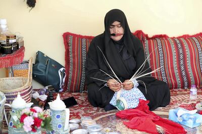 Sharjah, United Arab Emirates - Reporter: Razmig Bedirian. Arts. A lady creates baskets and plates using palm leaves at the Heart of Sharjah for Sharjah Heritage Days. Monday, March 22nd, 2021. Sharjah. Chris Whiteoak / The National