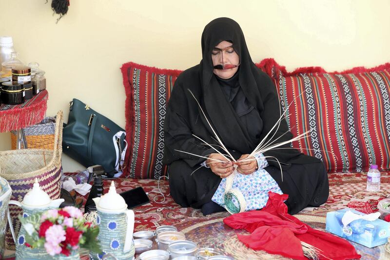 Sharjah, United Arab Emirates - Reporter: Razmig Bedirian. Arts. A lady creates baskets and plates using palm leaves at the Heart of Sharjah for Sharjah Heritage Days. Monday, March 22nd, 2021. Sharjah. Chris Whiteoak / The National