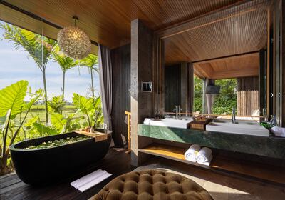 A notable highlight is the flower-filled bathtub that awaits guests on arrival. Photo: Gdas Bali