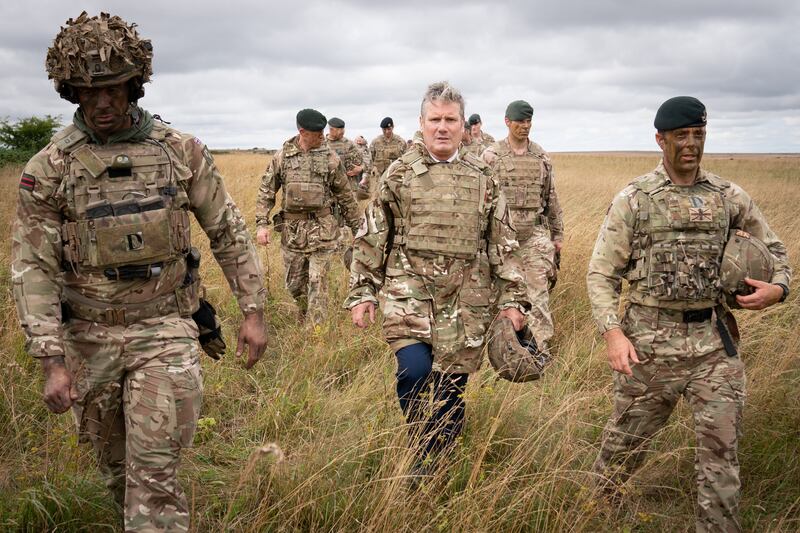 Labour leader Sir Keir Starmer with British soldiers in Wiltshire on Wednesday, where he saw Ukrainian soldiers being trained by the army as part of Operation Interflux. PA