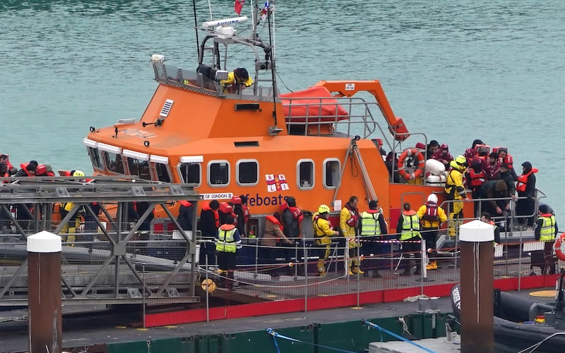 Migrants were brought ashore from an RNLI lifeboat in Dover. PA