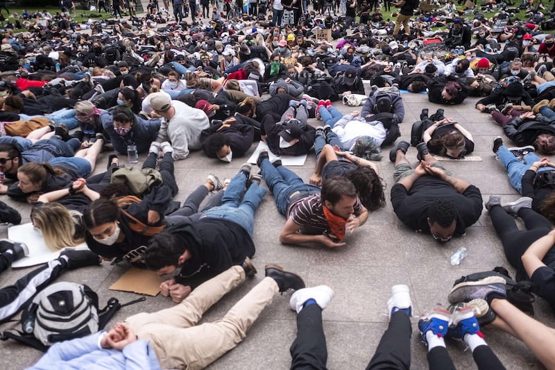 Protesters perform a mass 'die-in' in front of the Ohio Statehouse at the exact time George Floyd died on May 25 in Minneapolis police custody in Columbus, Ohio. Getty Images