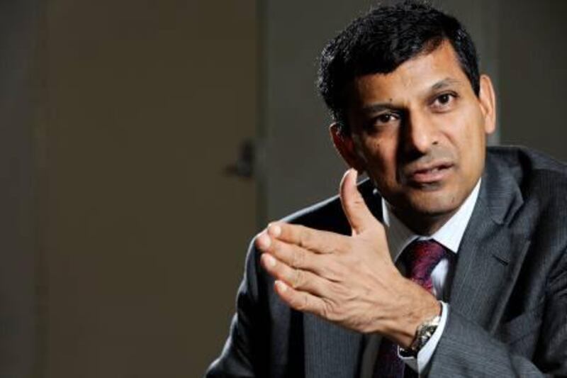 Raghuram Rajan, chief economic adviser to the government of India, gestures as he speaks during an interview in Singapore, on Saturday, April 6, 2013. India's current-account gap was probably "significantly" narrower in January to March as overseas sales recovered, Rajan said. Photographer: Munshi Ahmed/Bloomberg *** Local Caption *** Raghuram Rajan